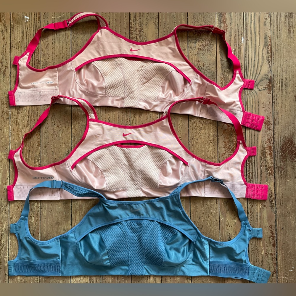 Three Nike Ultrabreathe Sports Bras, Medium, 2 pink and 1 blue